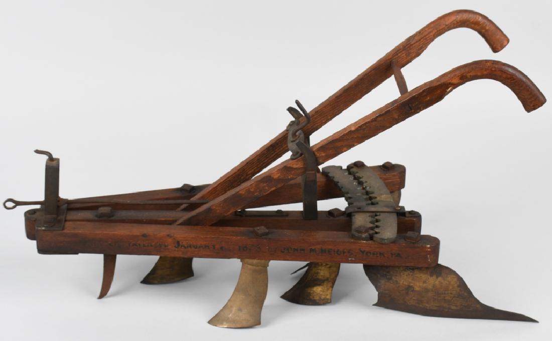 1873 MONARCH SALESMAN SAMPLE PLOW: Monarch Salesman Sample Plow. Horse drawn walk behind model. Very well made metal and wood construction. Nice details throughout. Marked Monarch and John M Heiges York, Pa. January 1873. Great early s