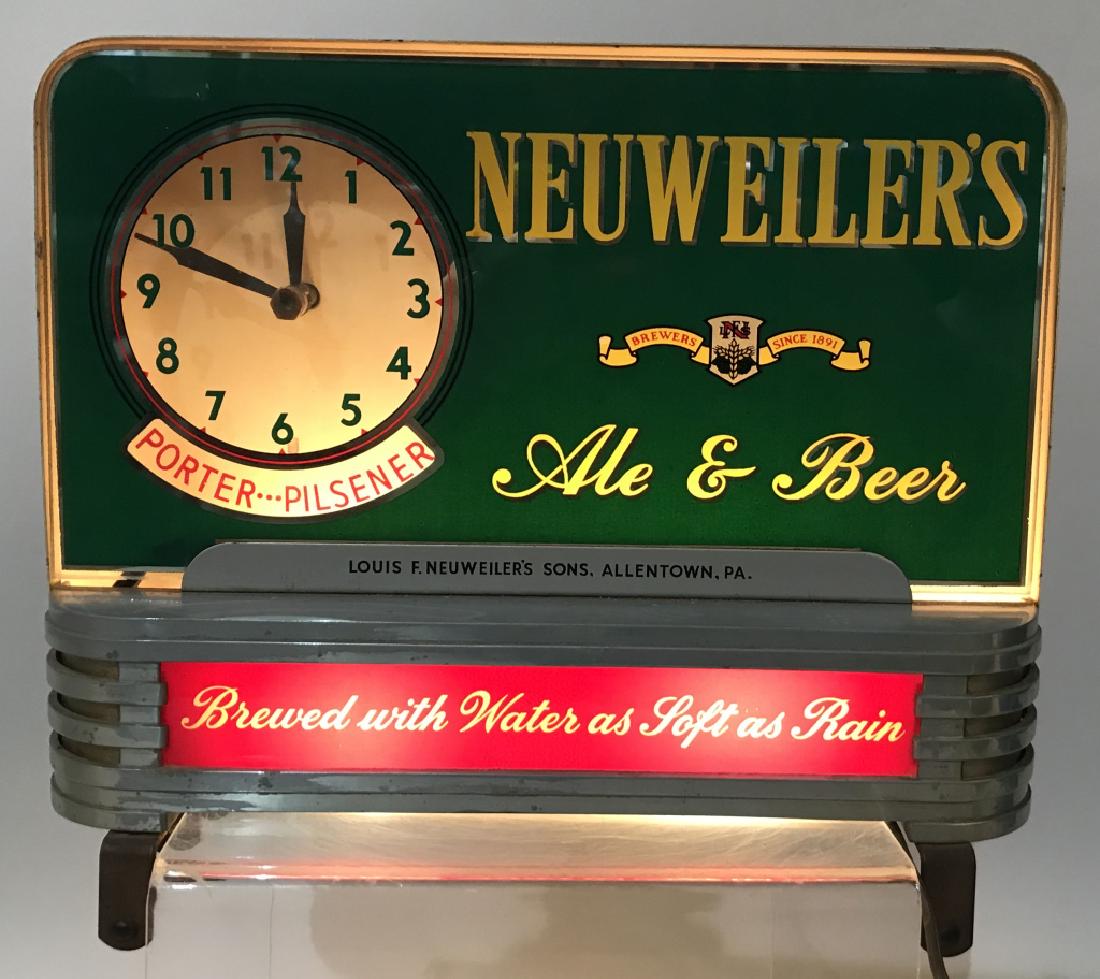 NEUWEILER'S BEER REVERSE GLASS LIGHT UP CLOCK: Neuweiler's Ale & Beer reverse painted glass light up Clock. Has spinning advertisement. All original with great colors. Works well. Still has bottom mounting hardware. Works. 12"x10" Excellent