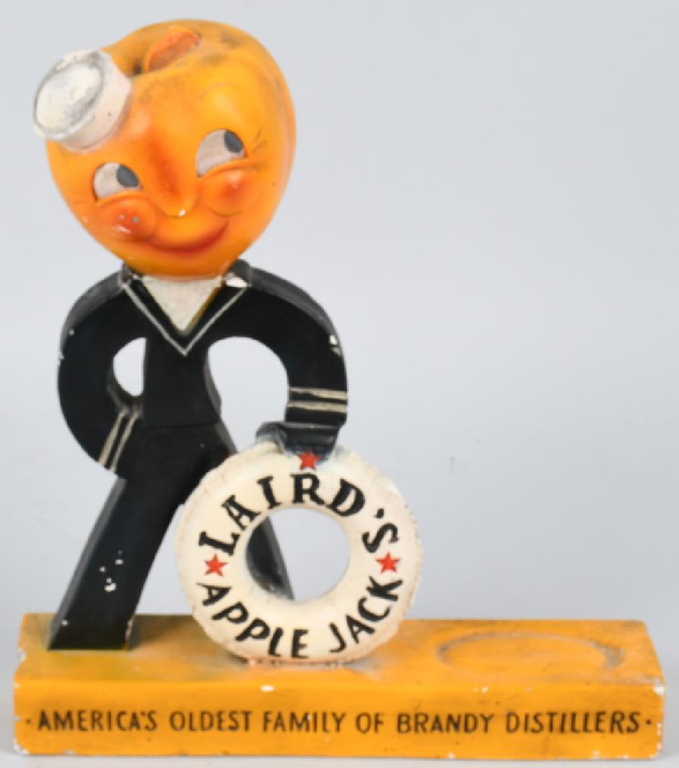 LAIRD'S APPLE JACK BRANDY STORE DISPLAY: Vintage Laird's Apple Jack Brandy counter display. Made of chalk ware, this display measures about 13 1/2" tall and 11 3/4" long. Character is dressed in a navy uniform, and is holding a life preserve