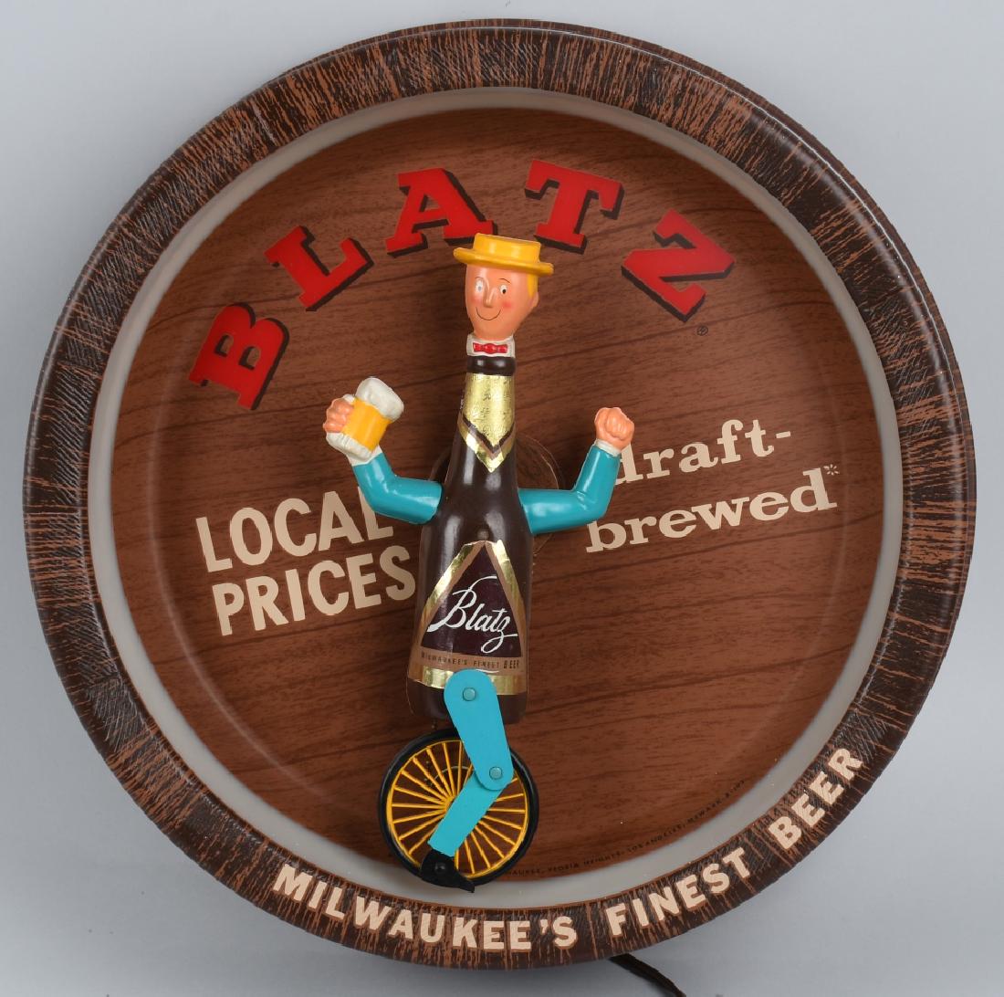 BLATZ LIGHTED UNICYCLE ANIMATED SIGN: Sign lit up and worked well when tested. 18" diameter. Brewed in Milwaukee, Wisconsin, Excellent