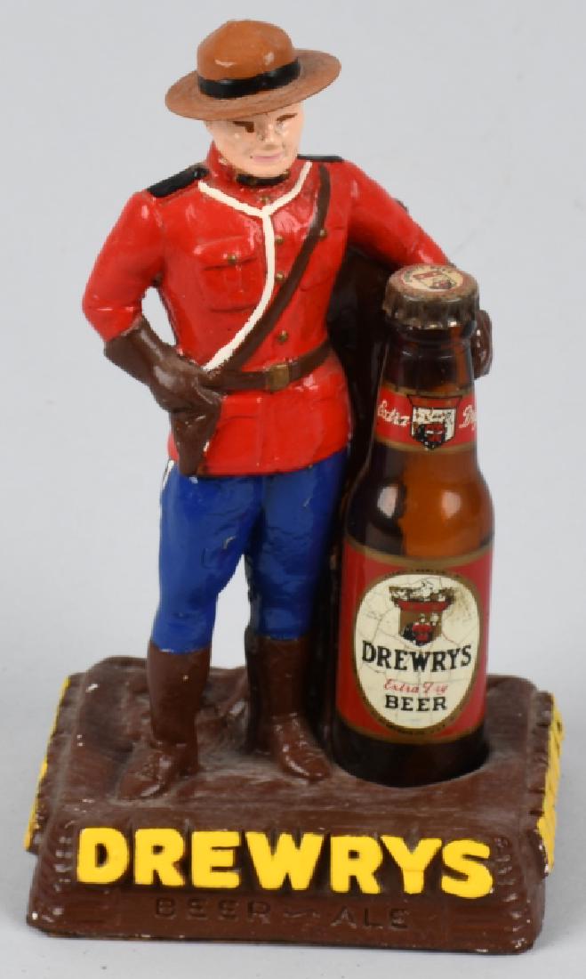 DREWRYS BEER MOUNTIE ADVERTISING FIGURE: Drewrys Beer chalk Mountie Advertising Figure. Nice colors with mini glass bottle. Drewrys was brewed in Winnipeg, Canada. 7" Excellent