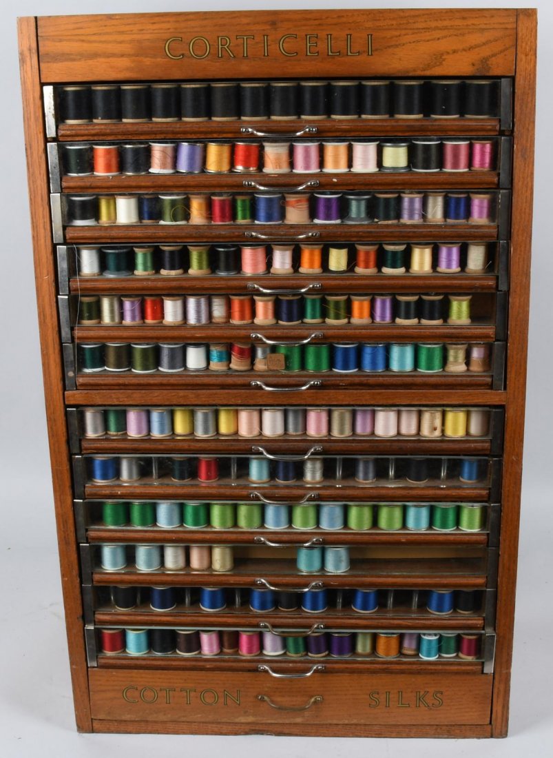 CORTICELLI COUNTRY STORE SPOOL CABINET: Excellent original Corticelli Country Store Spool Cabinet. Wood and glass construction. Has 13 pull out drawers. Nice original finish and decal. Full of thread. 32\"x20\"x17\" Excellent