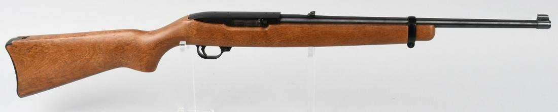 RUGER 10 22 CARBINE SEMI AUTOMATIC RIFLE .22: SN 127-95335. 19" barrel semi automatic rifle in .22 LR. Ruger 10/22 Carbine. Features smooth wood stock, black matte finish, and adjustable rear sight. Bore excellent, action flawless. Includes one m