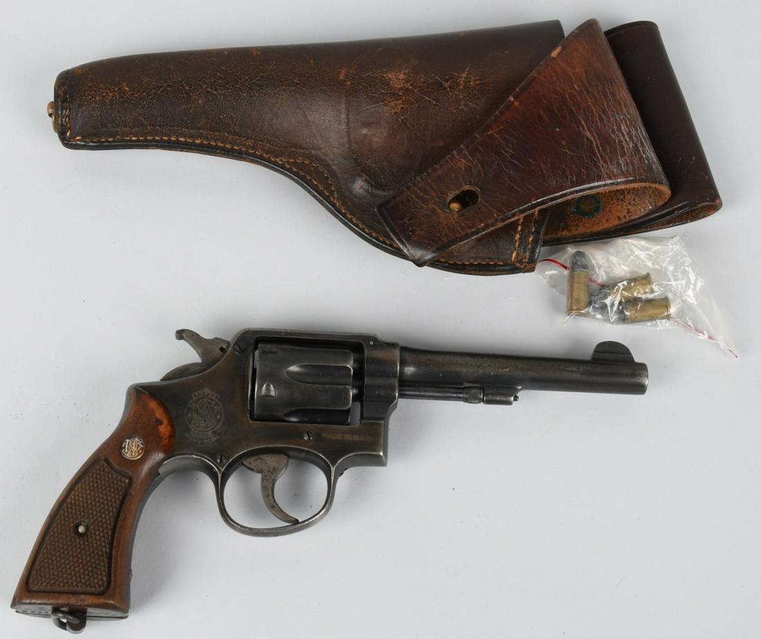 SMITH & WESSON MILITARY MODEL 10 .38 S&W REVOLVER: SN 3778 / 863789. 5" barrel, 6-shot double action revolver in .38 S&W. Smith & Wesson Model 10 with military proofs. Features blued finish, checkered walnut S&W Medallion grips, and lanyard ring. Mark