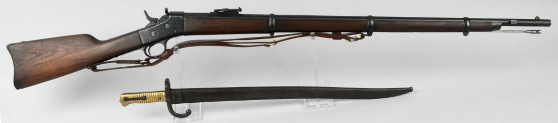 MODEL 1879 ARGENTINE ROLLING BLOCK RIFLE & BAYONET: NO SERIAL NUMBER - ANTIQUE. 34.5" barrel single shot rolling block rifle in .43 Spanish. Marked "Modello Argention 1879 E.N." Features adjustable rear sight, cleaning rod, and comes with brass handled