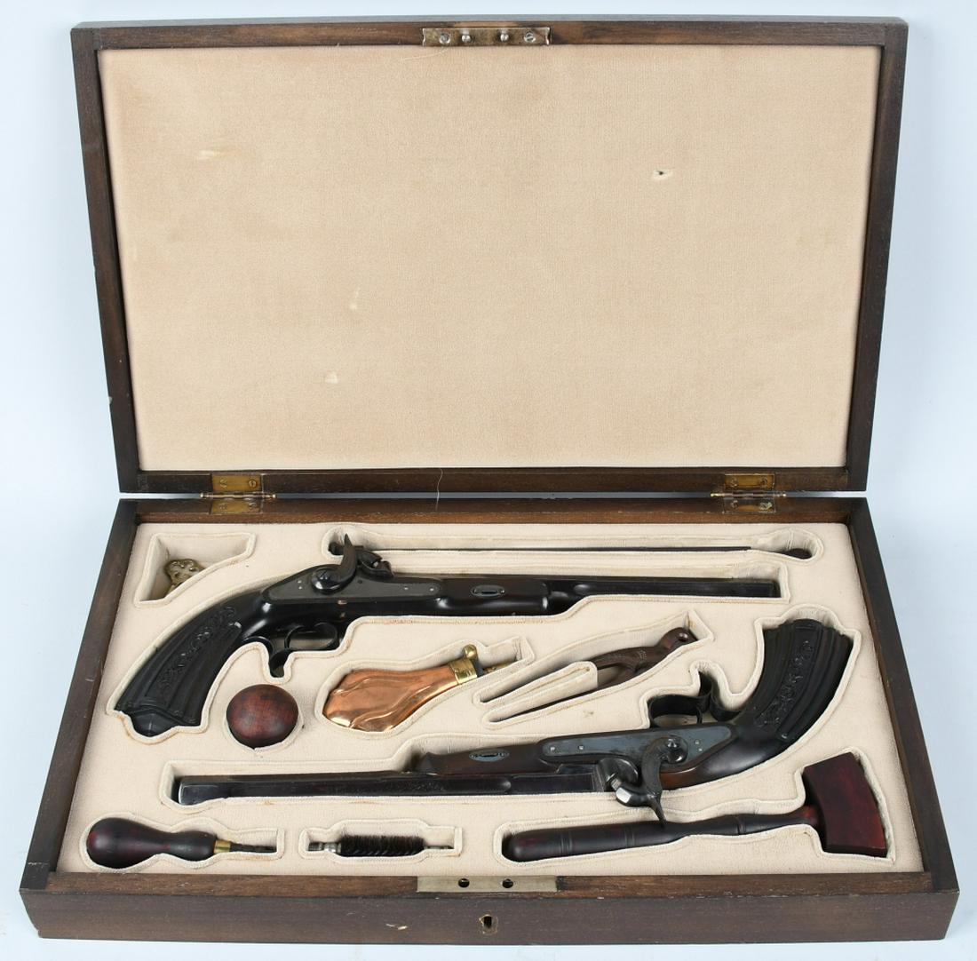 CASED SET OF BLACK POWDER DUELING PISTOLS: SN 84.549 & 84.556.9" Barrel, .44 Caliber cap & ball black powder, single-shot pistols. Blued finish, made in Eibar, Spain. Comes in presentation case with powder flask, bore brush, key, cap crimper,
