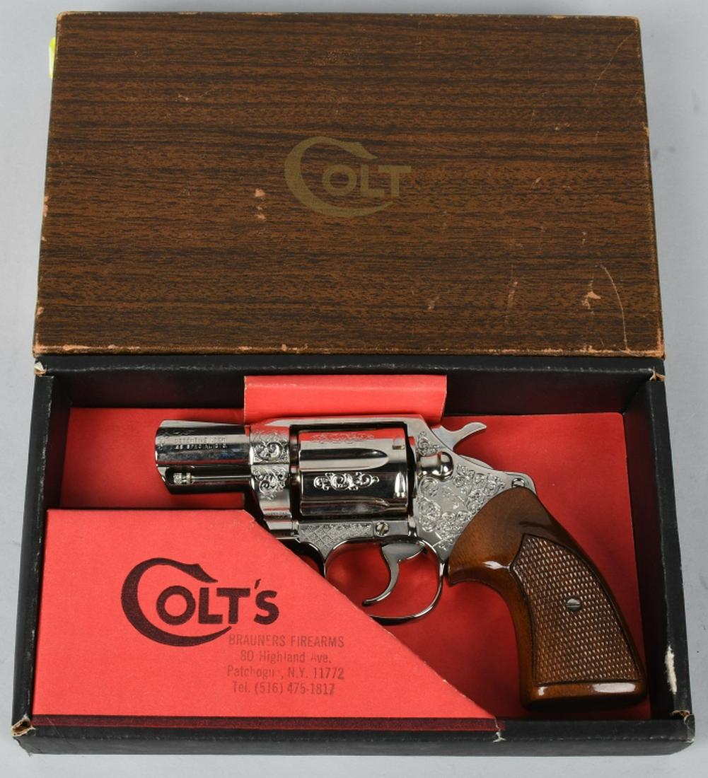 COLT DETECTIVE SPECIAL 38 REVOLVER ENGRAVED BOXED: SN M23156, made in 1975. 2" barrel 6-shot revolver in .38. Colt Detective Special, engraved, in original Colt cardboard box with SN on the side. Features nickel finish, checkered wood grips, and full