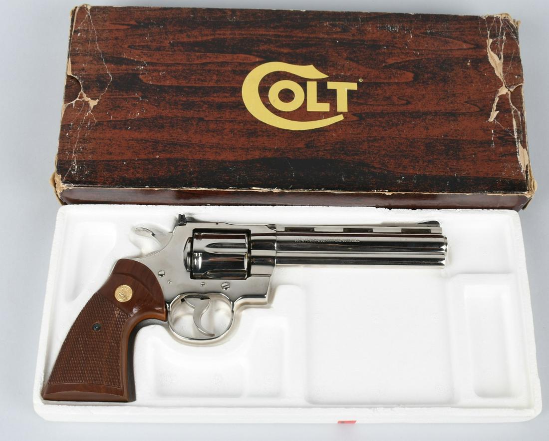 COLT PYTHON 357 REVOLVER 6" NICKEL IN ORIGINAL BOX: SN K37018, made in 1981. 6" barrel 6-shot double action revolver in .357 Magnum. Colt Python. Features adjustable sight, checkered wood, gold Colt medallion grips, and nickel finish. Comes in original