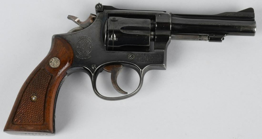 SMITH & WESSON MODEL 15 COMBAT .38 REVOLVER: SN 1K62562. 4" barrel 6-shot double action revolver in .38 S&W Special CTG. Smith & Wesson Model 15-3 Combat Masterpiece. Features heavy barrel, adjustable rear sights, checkered wood S&W Medallion gr