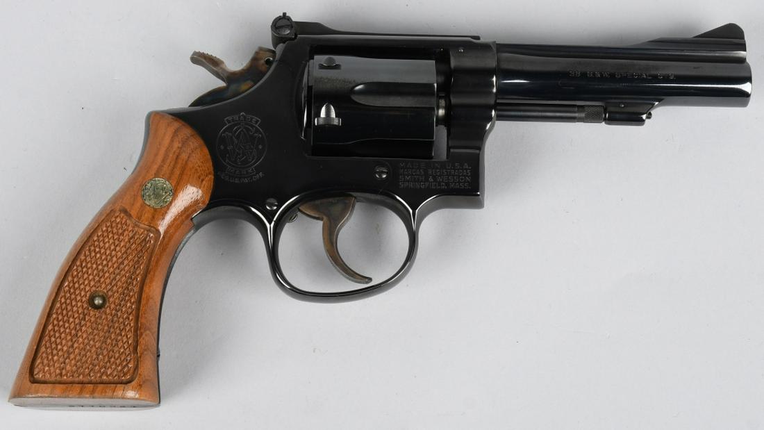 SMITH & WESSON MODEL 15-3 DA REVOLVER 38 COMBAT: SN 19K0116. 4" barrel double action 6-shot revolver in .38 SPL. Smith & Wesson Model 15-3 K-38 Combat Masterpiece. Features adjustable rear sight, serrated backstrap, S&W medallion checkered wood grip