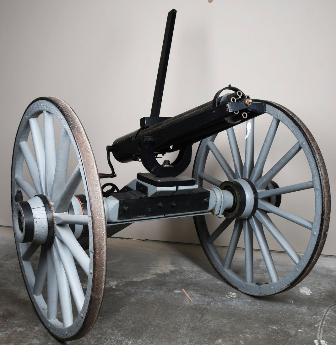 GATLING GUN FULL SIZE MGM MOVIE PROP: Impressive reproduction full size Gatling Gun used as MGM movie prop. Measures about 87" long, axle is 60" wide, 45" diameter wheels, 63" high overall and about 47" barrels. When cranked the barrels t