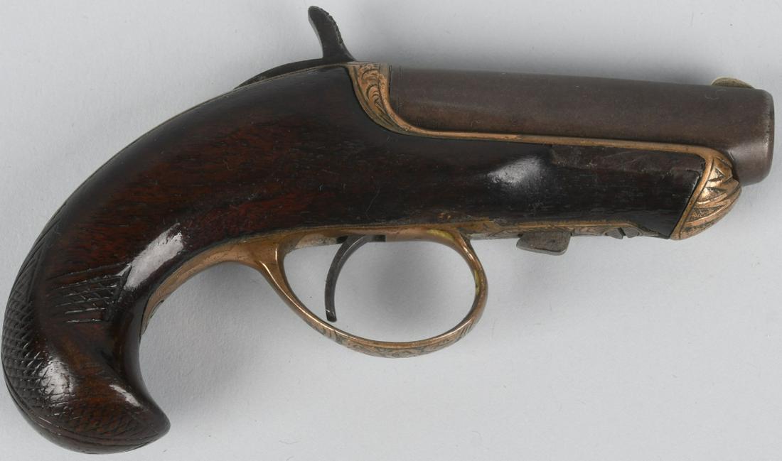 WILLIAMSON .41 SINGLE SHOT DERRINGER: SN 4100, MFG 1866-1870, total production less than 10,000. 2 1/2" .41 caliber with very good bore. Barrel slides forward for loading. Left side of barrel marked " Williamson's Pat. Oct 2, 1866, New Yo