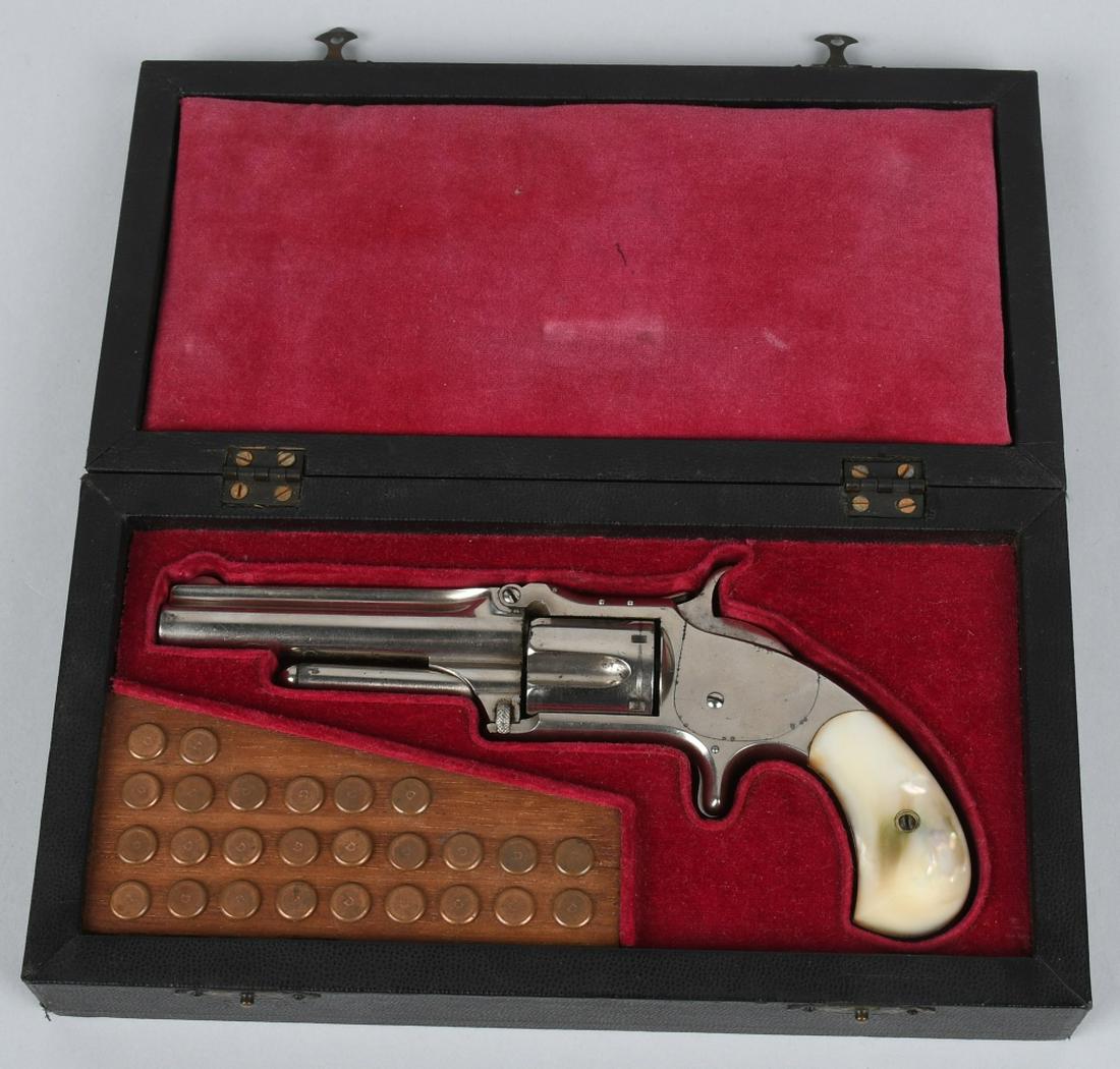 CASED SMITH & WESSON 1 1/2 .32 REVOLVER: SN 82089, Model 1 1/2 second issue Revolver. MFG 1868-1875, 3 1/2", .32 long rim fire barrel with nice bore. Marked on top of barrel "Smith & Wesson Springfield Mass" and 1855, 1859 and 1865 patent da