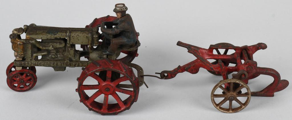 ARCADE cast iron McCORMICK DEERING FARMALL & PLOW: Scarce and all original Arcade cast iron McCormick Deering Farmall tractor along with a Arcade 2 bottom plow. No cracks or breaks. Both should clean to a higher grade, and both have Arcade decals. Tra