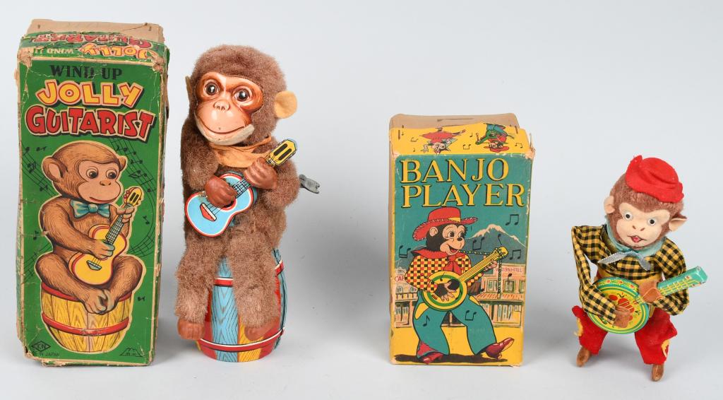 2- JAPAN WINDUP MONKEY TOYS w/ BOXES: Includes Jolly Guitarist and Banjo Player. Both original and working. Boxed. Largest 8 1/2" Excellent