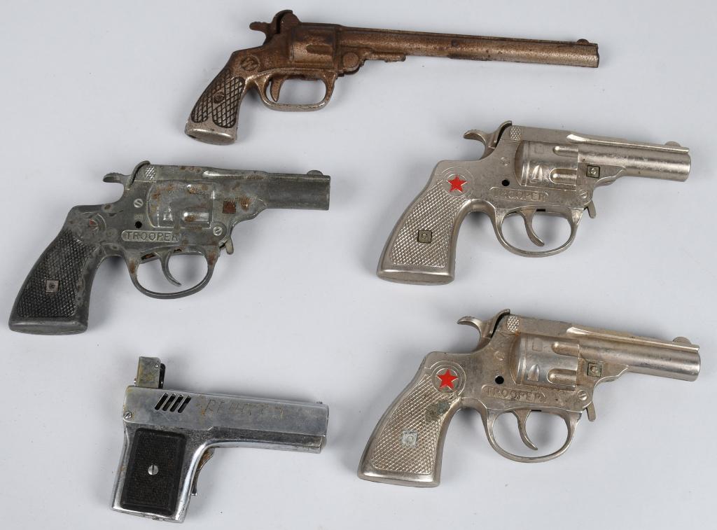 4- CAP GUNS & MORE: Includes 3 Trooper Cap Guns, Two Time Cast Iron Cap Gun, and Gun Lighter. Largest 9" Conditions Vary