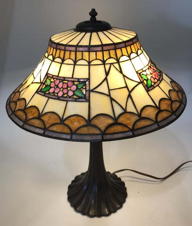 DUFFNER & KIMBERLY FLORAL LEADED GLASS LAMP: Duffner and Kimberly Floral Stained Leaded Glass Table Lamp. Very nice stained leaded glass shade with floral pattern. Very nice colors. Has typical cracked panels. 20" wide by 7 1/2" high. Ornate pot