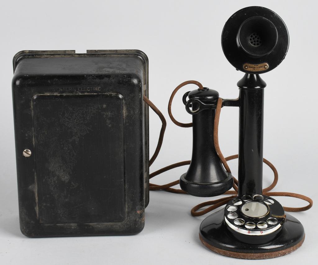 WESTERN ELECTRIC DIAL CANDLESTICK PHONE w/BELL BOX: Phone is complete with felt base and original paint. Receiver is marked. A great display piece. The bell box is marked Western Electric and Model 554 AR. The bell box shows wear. Very Good