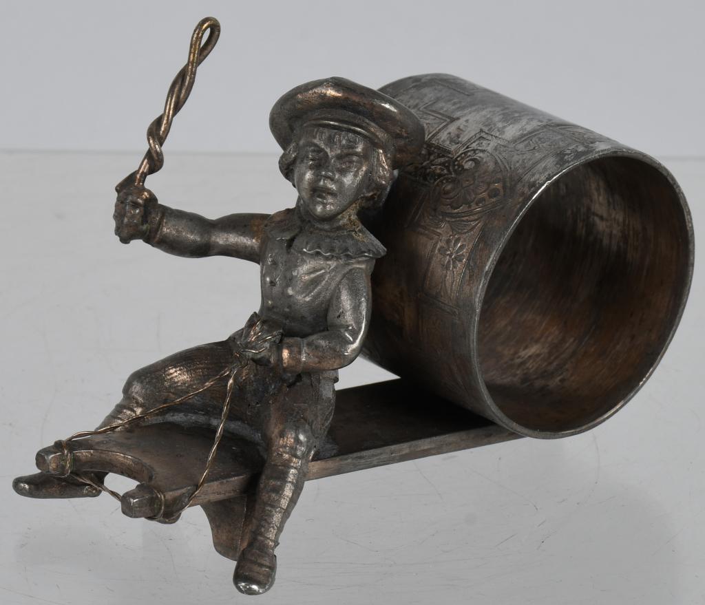 FIGURAL NAPKIN RING BOY on SLED, ROGERS BROS: Very nice boy on sled figural silverplate napkin ring made by Rogers Bros. 4", Excellent
