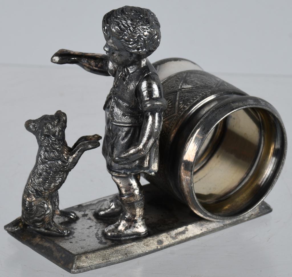 FIGURAL NAPKIN RING BOY TRAINING DOG: Very nice boy training dog figural silverplate napkin ring made by Rogers Smith Meriden. 3 1/2" by 3 1/2", Excellent