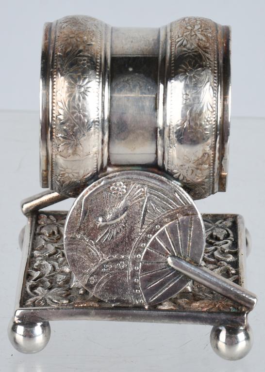 FIGURAL BUTTERFLY & FANS SILVERPLATE NAPKIN RING: Made by Meriden, beautiful detail, has fan with bird on it on both sides, and butterfly under the ring. 3", Excellent