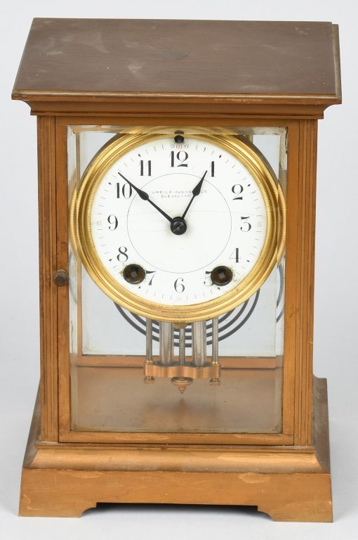 SETH THOMAS BRASS & GLASS MANTLE CLOCK: Clock was made by Seth Thomas but was distributed by Cowell & Hubbard Cleveland Ohio which marked on the porcelain face. The works are marked ST 48S. Clock case is brass with beveled glass throughout.