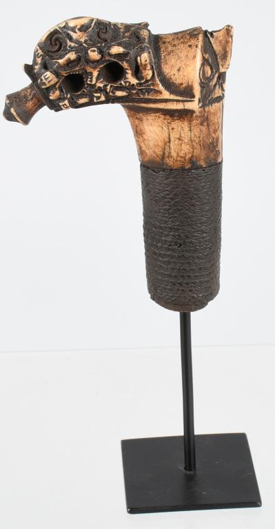 DAYAK BORNEO SWORD HANDLE ca. 18th C.: Dayak Borneo Island 18th Century Deer Antler Sword Handle Fine Rattan Binding Having a intricate carved surface depicting a Bird of Prey & Dragon Head Provenance: Ex- private collection of Ami Brown. 