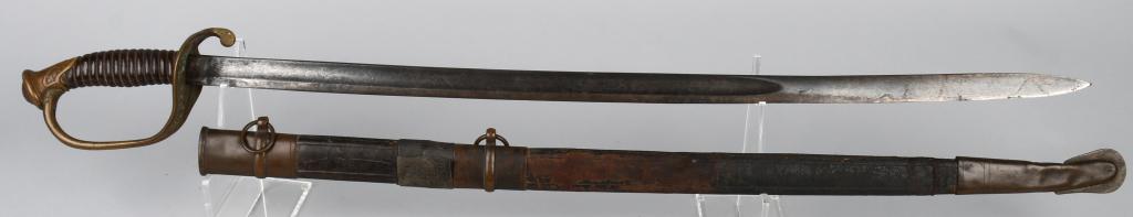 M1850 CIVIL WAR FOOT OFFICERS SWORD W/ SCABBARD: M1850 foot Officer's Sword. The hilt is complete with scabbard but it does have a break in the leather. The blade is 31 inches long and has nice double etching to each side of the blade but has some s