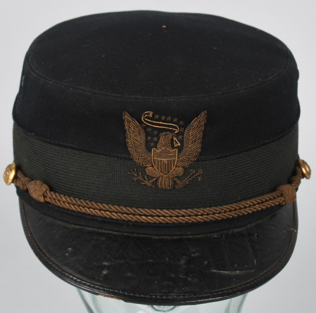 U.S. MODEL 1895 OHIO NATIONAL GUARD OFFICER's CAP: Well preserved original hat belonging to an Officer of the 2nd regiment of the Ohio National guard. Has Ohio state buttons and gold officer's braid. There is a bullion eagle with 13 stars. The cap is 