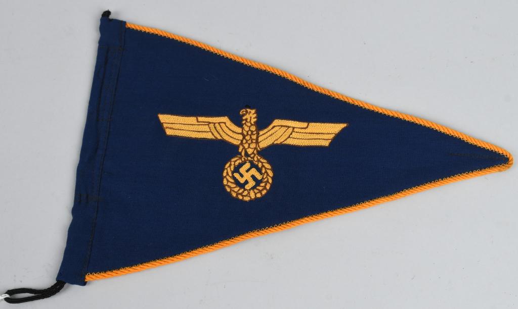 WWII NAZI GERMAN KRIEGSMARINE VEHICLE PENNANT: Roughly 21cm tall 32cm long dual-sided 1936-1945 pattern horizontal isosceles triangle pennant features a vertically ribbed navy blue cotton/rayon blend base with a hand embroidered national eagle wit
