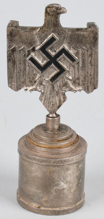 WWII NAZI GERMAN DRL SPORTS DESK ORNAMENT: DRL sports desk ornament measuring 5 1/2 inches tall X 2 1/4 wide. Made from nickle/silver plated alloy. The eagle and swastika to both sides retains most of its original black paint. Nice example The