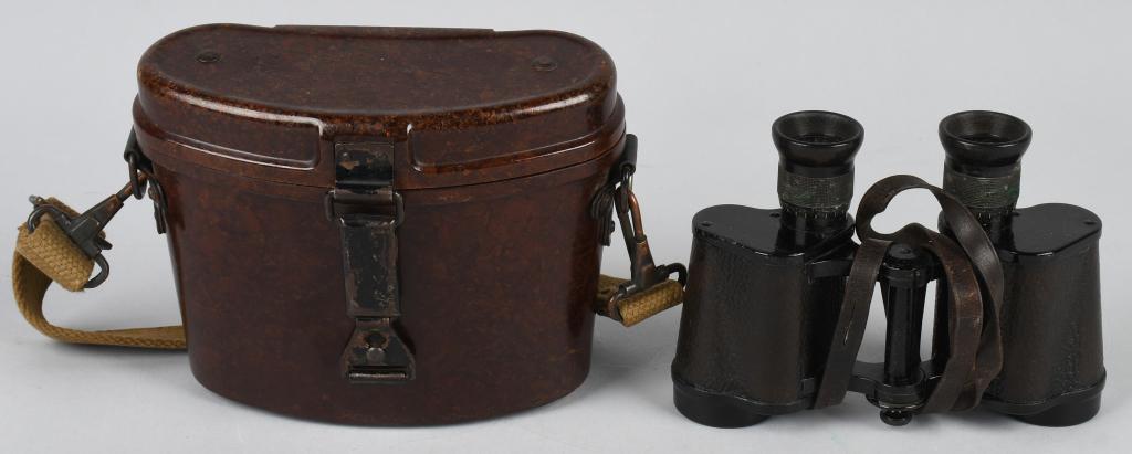 WWII CASED 6 X 30 POWER ISSUE FIELD BINOCULARS: Tooled alloy and aluminum construction 6 x 30 power binoculars with black bakelite and simulated leather fittings. The lens bodies retains most of their simulated, grained black leather coverings and 