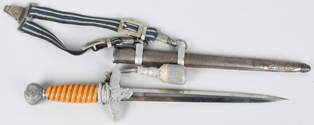 WWII NAZI GERMAN 2ND MODEL LUFTWAFFE DAGGER: Nazi German 2nd model luftwaffe dagger. Comes with deluxe set of hangers. The blade is 10" and 17" overall. Comes with original portapee. The blade is marked alcoso. The blade has minor spotting. The 
