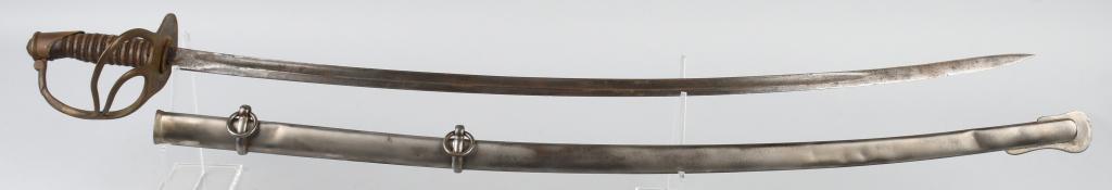 US MODEL 1872 CAVALRY SWORD & SCABBARD: The sword has a 34" unmarked blade with unstopped fuller. It is 7/8" wide at the ricasso. The blade has a bend 4 1/2" from the point and the tang has ben re-peened. Brass hilt is stamped "30" undernea