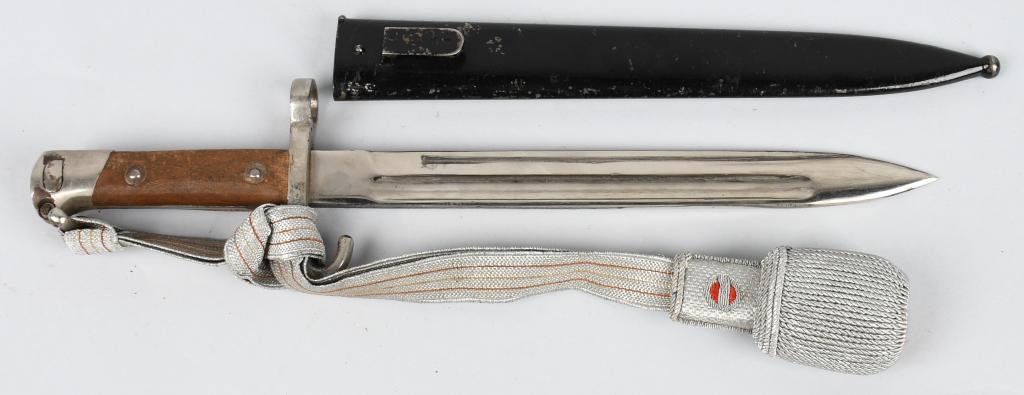 AUSTRIAN M1895 NCO DRESS BAYONET WITH PORTEPEE: Model 1895 Austrian Dress bayonet with pained metal scabbard and parade portipee. Austro-Hungarian NCO model with silver bullion portipee with red felt accents. Bayonet is nickel plated with smooth wo