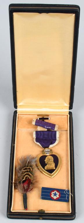 WWII EARLY PURPLE HEART W/ PUSH BUTTON BOX: Early numbered Purple Heart 88708 with early non titled push button box. Purple Heart and box are both in excellent condition. These early push button boxes are almost impossible to find these days Th