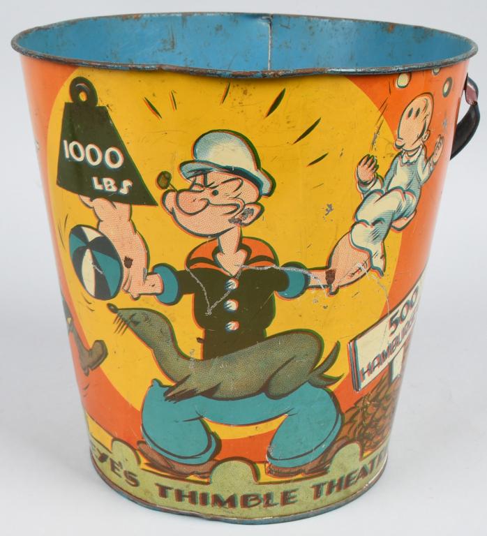 8" 1933 POPEYE THIMBLE THEATER SAND PAIL: Wonderful early Popeye Thimble Theater Sand Pail. Great graphics of Popeye, Olive Oyl, Whimpy, and Sweet Pea. Still has nice colors. Interior has some period repaint. Pail displays very well. A super