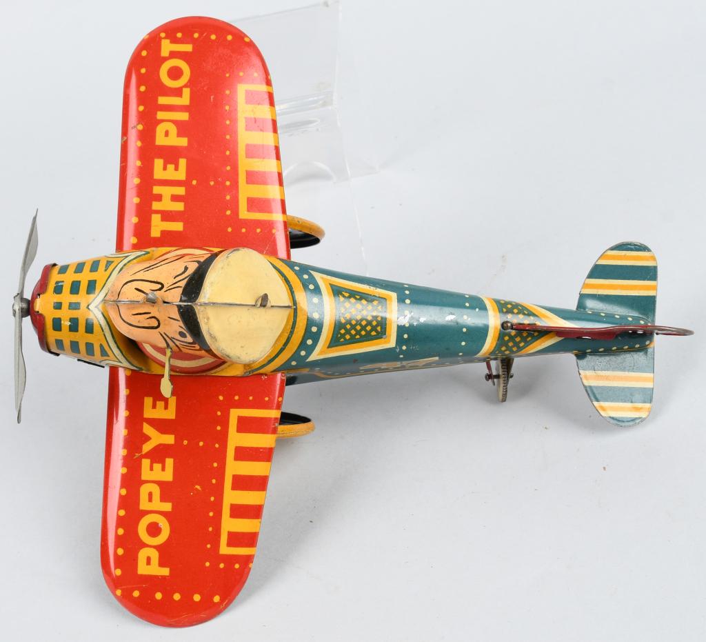 MARX Tin Windup POPEYE THE PILOT Early Version: Excellent Marx tin windup Popeye The Pilot. Scarce early version. All original and complete. Very nice colors. Windup works. Nice example. 8 1/2" Excellent