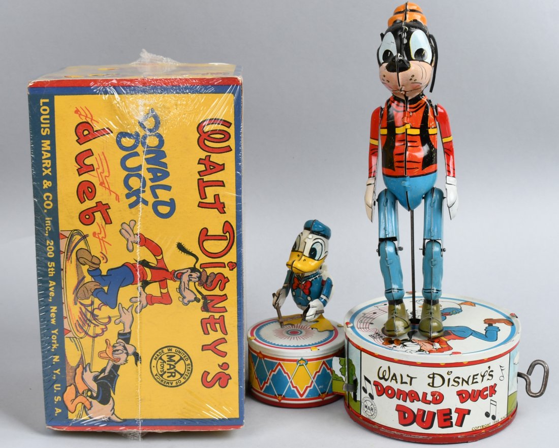 MARX Tin Windup DONALD DUCK DUET w/ BOX: Nice Marx tin windup Donald Duck Duet. All original with great colors. Windup works. Goofy missing one rubber ear. With colorful Box. 10" Excellent