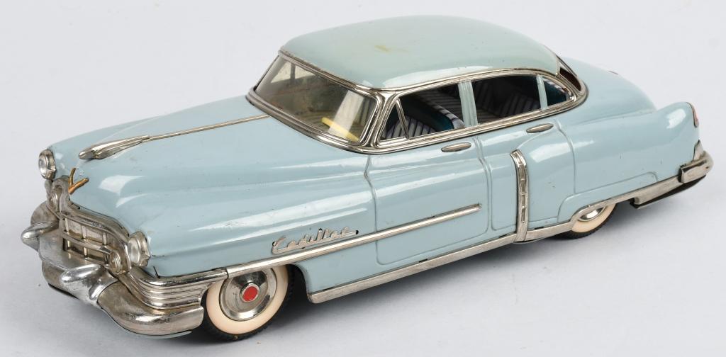 MARUSAN Tin Friction 1954 CADILLAC SEDAN: Excellent tin friction 1954 Cadillac Sedan made in Japan. This is one of the finest detailed most desirable tin cars there is. Very nice all original example. Friction version that works. A great addi
