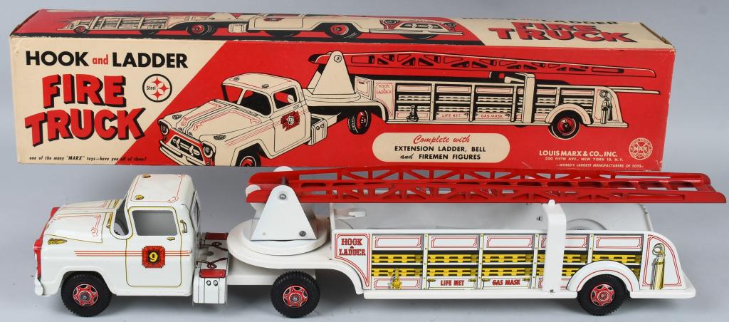MARX HOOK & LADDER FIRE TRUCK w/ BOX: New Old Stock. Pressed steel Hook & Ladder Fire Truck. Unusual white color. Great paint and graphics. Comes with ladders and Fireman figures. Boxed with Inserts. 28" Excellent