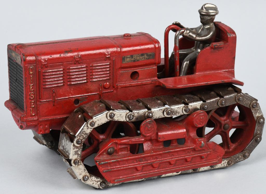 ARCADE CAST IRON INTERNATIONAL TRAC-TRACTOR: Excellent Arcade cast iron International Trac-Tractor. All original with very nice paint. Still has original decals. Nickel plate driver and tracks are original. No breaks or issues. A very impressive