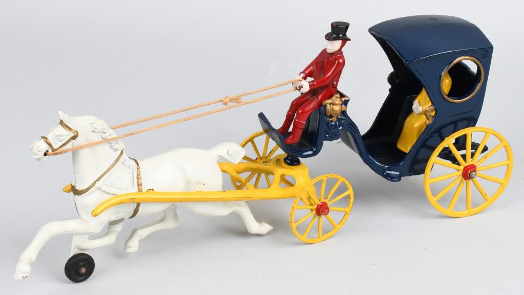 KENTON cast iron HORSE DRAWN HANSOM CAB: Nice all original Kenton cast iron horse drawn Hansom Cab. Features 8" galloping horse, top hat driver and lady passenger. No cracks or breaks and nice paint. All original including reins. Does not ap