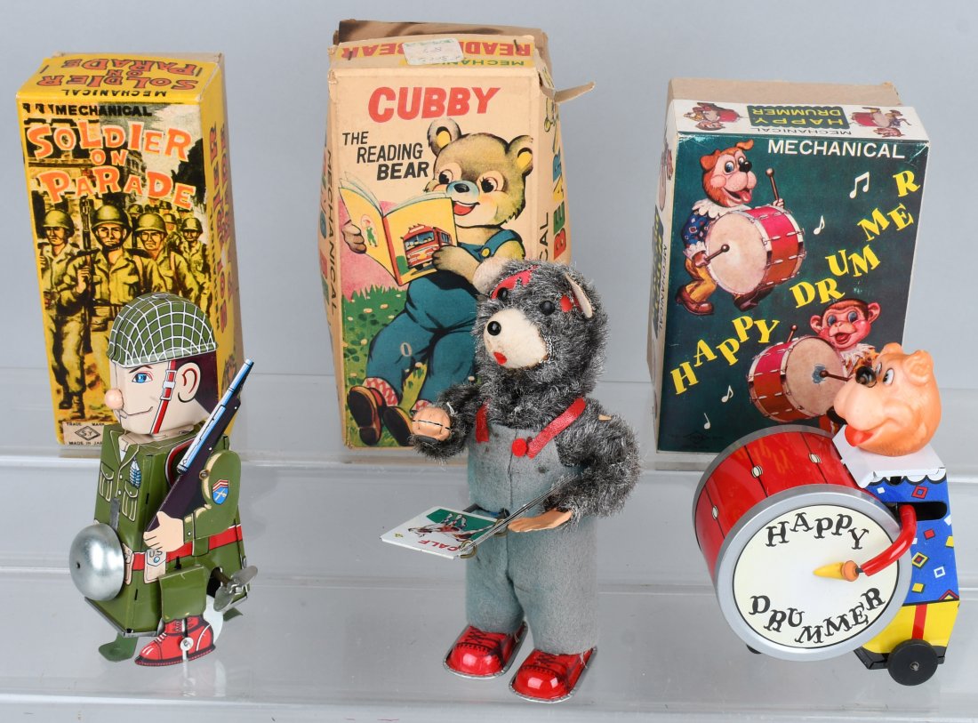 3-JAPAN tin windup TOYS w BOXES: Lot includes Cubby the Reading Bear, with rough original box, Happy Drum with nice original box, and Soldier on Parade with nice box. All worked when tested. The Cubby Bear has wear to plush covering.