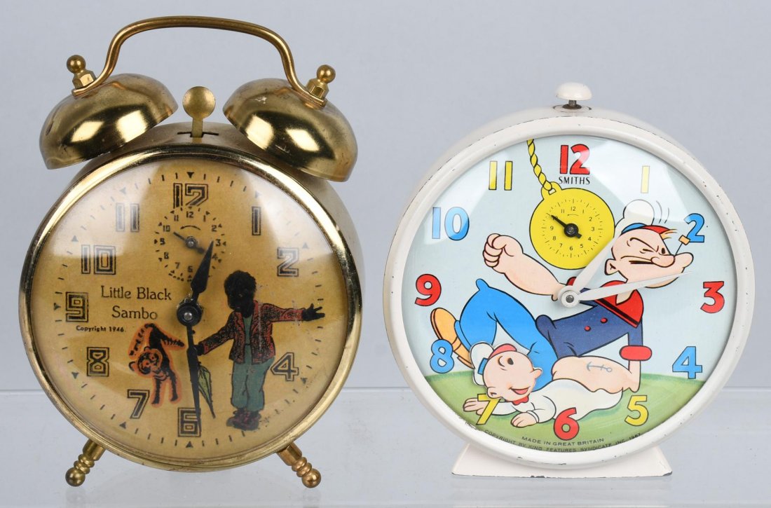 2- VINTAGE ALARM CLOCKS POPEYE & SAMBO: The Popeye clock is animated with Sweet Peas head moving as the second hand. It is made in Great Britain. The Little Black Sambo clock is dated 1946, and the back of the clock is marked Robert Shaws C