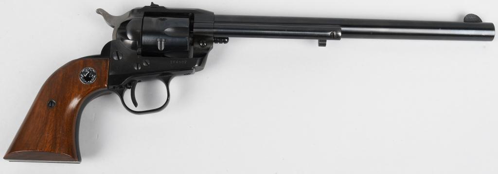 EARLY RUGER 9 1/2" SINGLE SIX REVOLVER (1960): Serial # 164902. This a a scarce bird, an early pre-warning single six made in 1960 with the long 9 1/2" barrel .22 caliber six shot single action revolver. Features full blue finish, fluted cylinder,