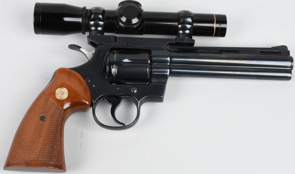 SCOPED COLT PYTHON DOUBLE ACTION REVOLVER: Serial # V47021. Made in 1979, gun features a 6" barrel, blue finish, six shot fluted cylinder, full vent rib, solid under lug, double action with wide target hammer and sporting type 3 checkered waln