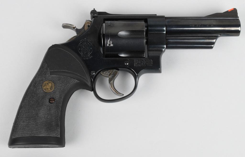 SMITH & WESSON MODEL 25-5 DOUBLE ACTION REVOLVER: Chambered for the classic cartridge, the .45 Long Colt round, this large six shot double action revolver is built on the 3-screw square butt N-target frame. Features include a 4" barrel, fully adjusta