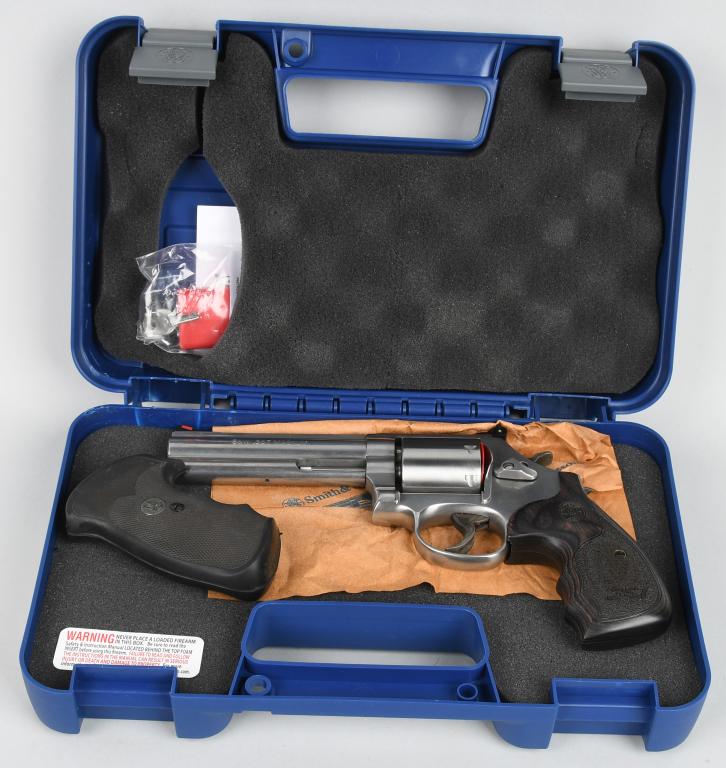 BOXED SMITH & WESSON MODEL 686-6 REVOLVER: Serial #DKM5945. This is the Distinguished Combat Magnum Plus 7-shot double action .357 magnum revolver. Built on the round butt L- frame in stainless steel with 3-screws. Other features include a sol