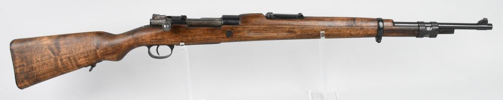 1935 SPANISH MODEL 98 MILITARY MAUSER BOLT RIFLE: Serial #2A-9612. Made by Fabrica de Armas La Corona model of 1935 in caliber 8mm. Receiver has crest. Barrel measures 24". There are no visible import stamps. The frame, floor plate and trigger guard 